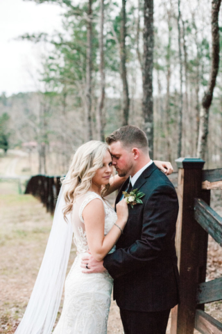 Ashlyn + Brock Harrell wedding Oak Meadow fence outside barn