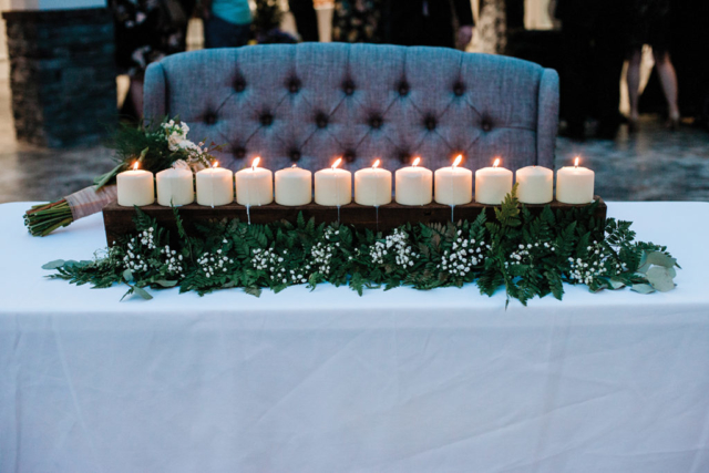 Ashlyn + Brock Harrell wedding Oak Meadow candles at night