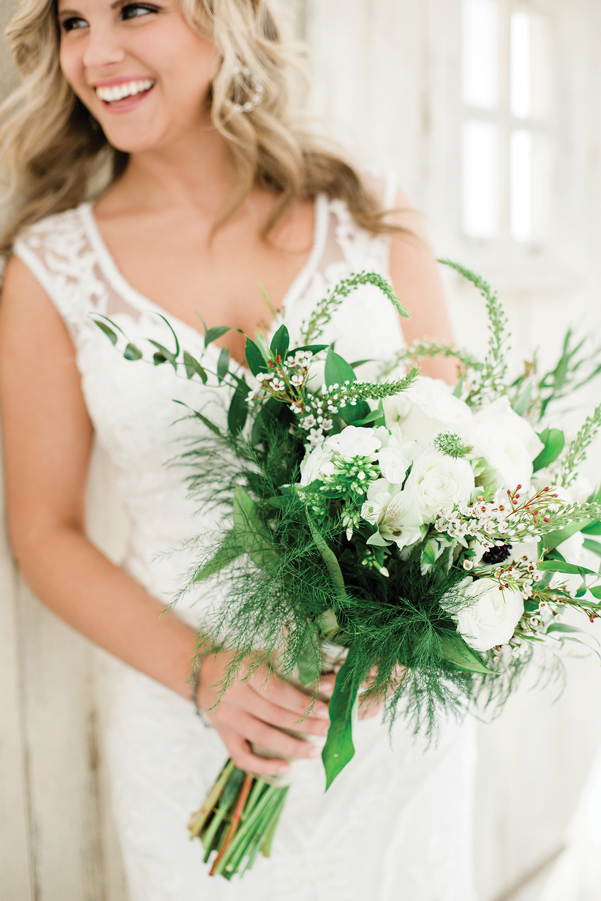 Ashlyn + Brock Harrell wedding Oak Meadow smiling bride green bouquet