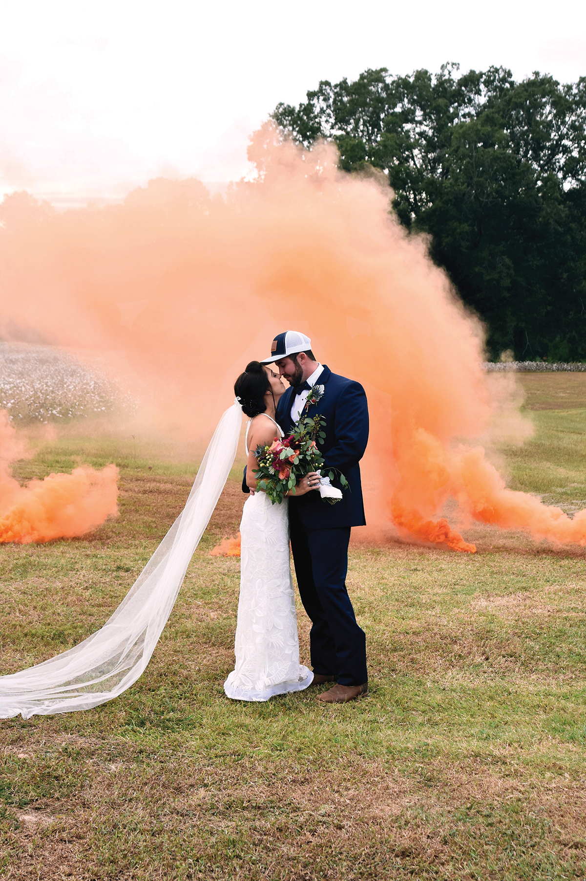 Jordan + Jordan Moore wedding couple kissing orange smoke