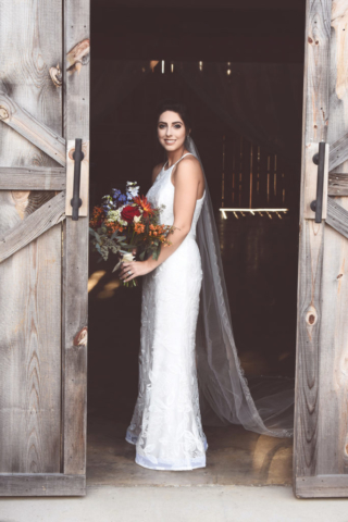 Jordan + Jordan Moore wedding bride photoshoot in front of barn