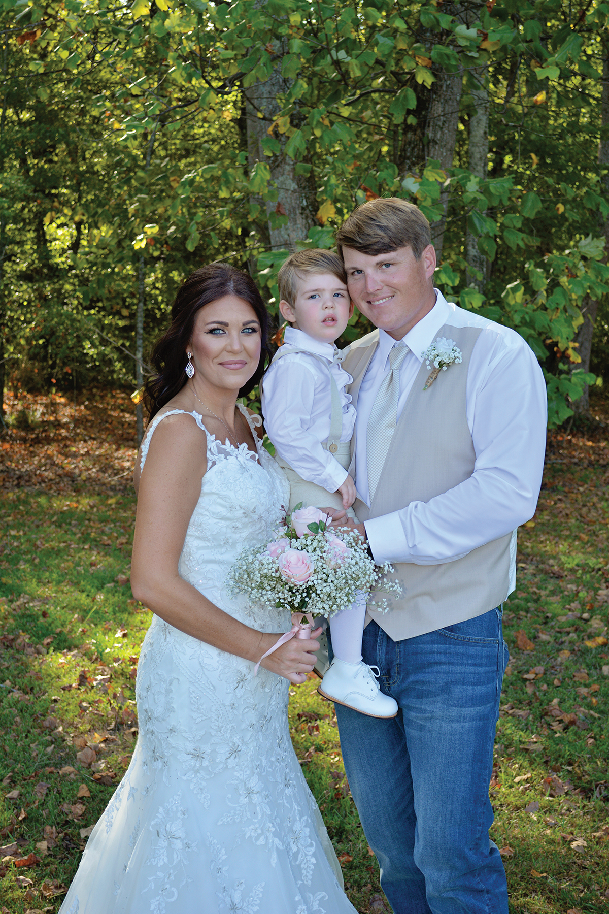 Shannon + Chris Naylor wedding posing with son