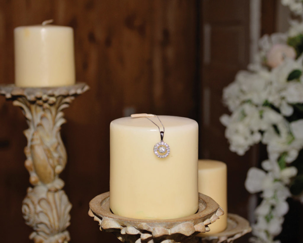 Shannon + Chris Naylor wedding pendant on candle