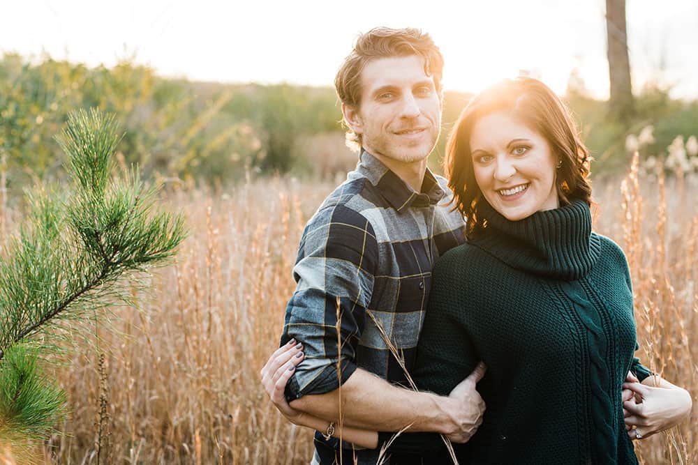 engaged couple in field