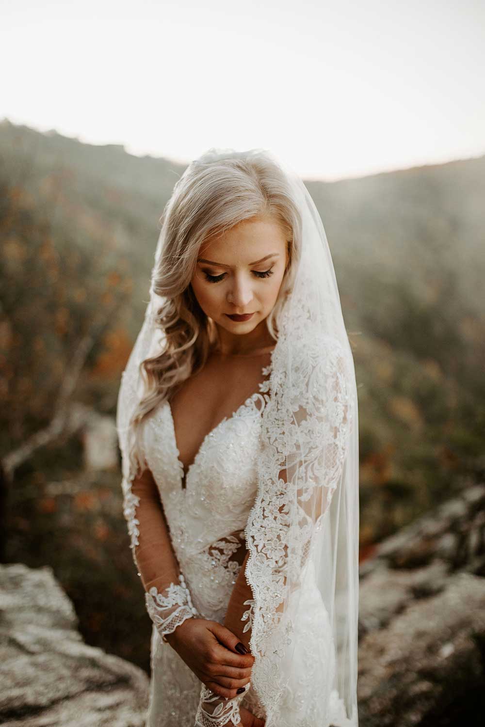 Kaylan-Chris-Alabama bride portrait on clif Cheaha Mountain fog