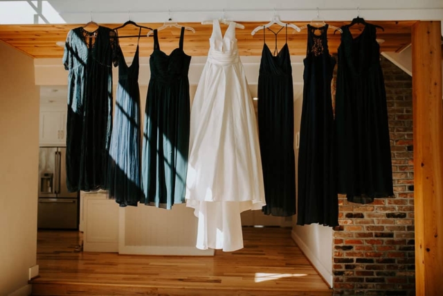Hanging wedding dress and bridesmaids dresses