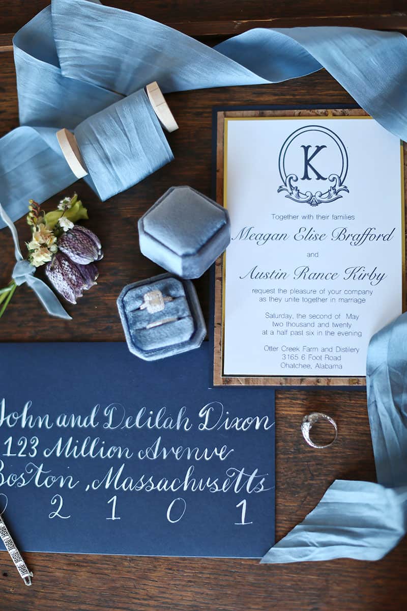 soft blue wedding invitation and wedding bands