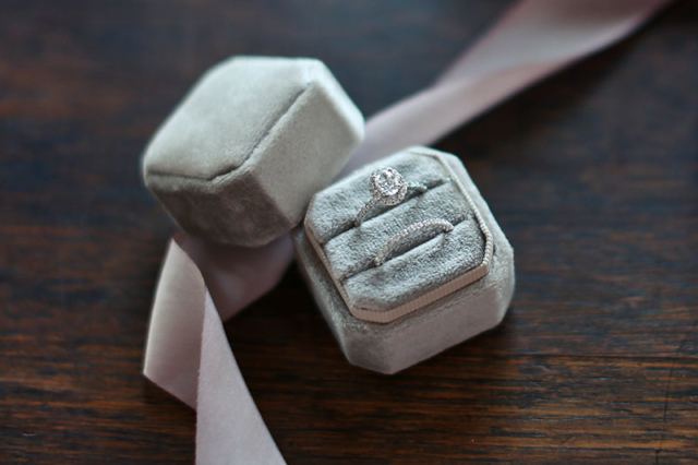 beautiful white gold diamond wedding band in grey ring box with pink ribbon