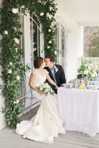 southern wedding country couple kissing at table