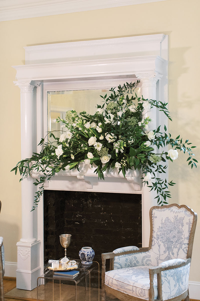 southern wedding country white flowers decor over fireplace