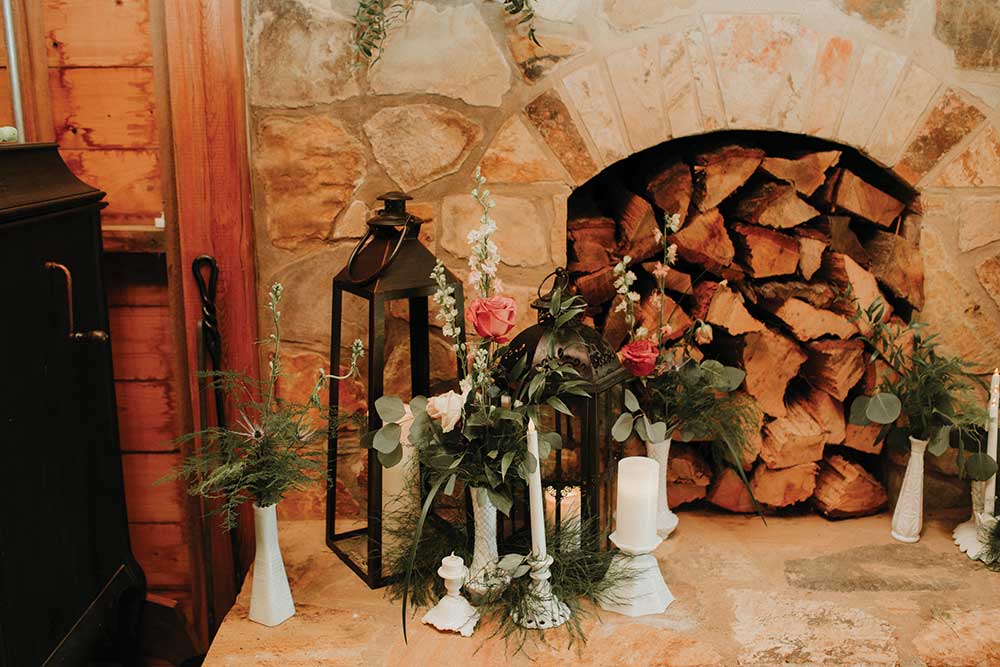 wedding decor fireplace, lantern, candle sticks