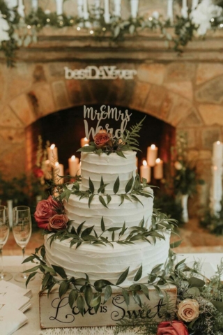 wedding cake, natural icing, fresh flowers and foliage