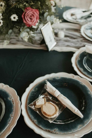 wedding reception table closeup, custom cookie, vintage china dark green plates
