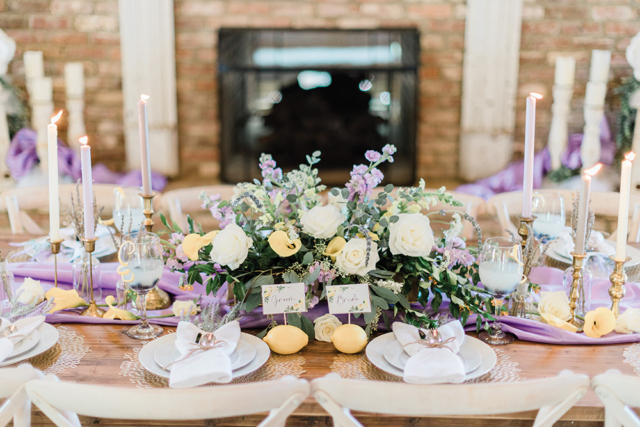 lemon and lavender wedding table decorations with candles and fresh country furniture