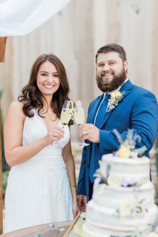 wedding couple toasting with lemon drinks in flutes